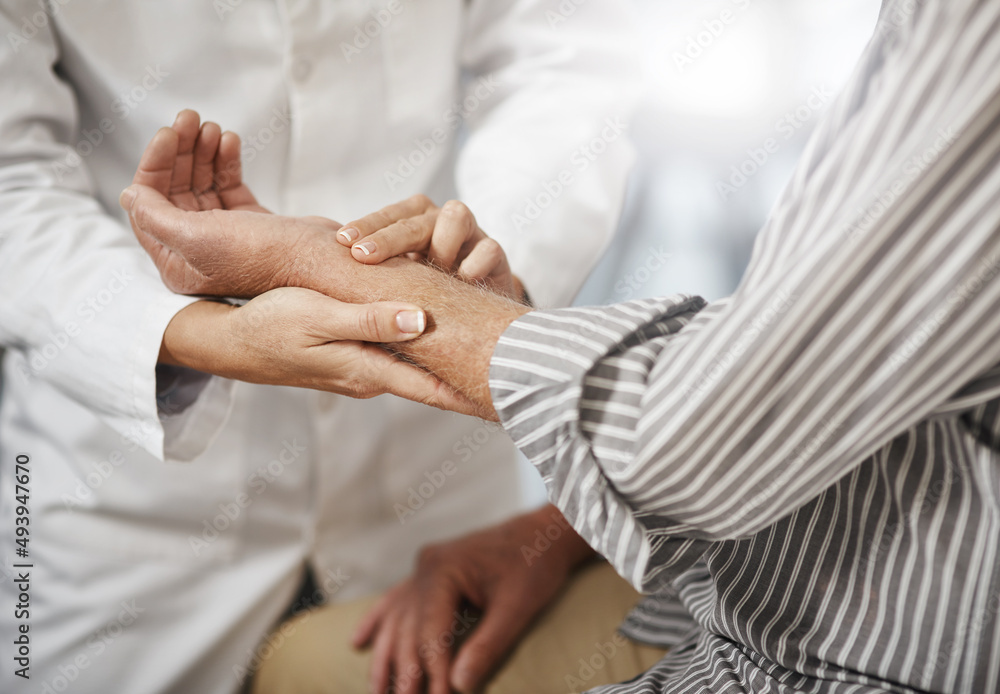 Poster Lets check your pulse. Cropped shot of an unrecognizable female doctor taking a male patients pulse during a consultation.