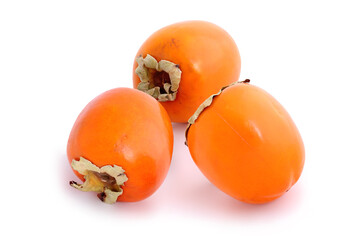 Three persimmons isolated on white background