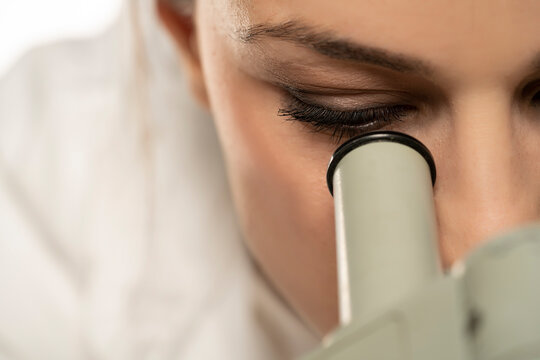 Macro Close Up Shot Of A Female Scientist Looking Into The Microscope.