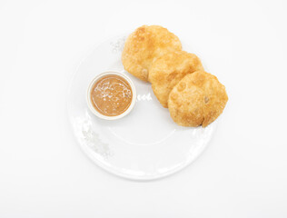 deep fried puri or Poori or luchi with sauce isolate on white background