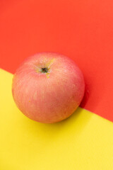 apple isolate on yellow and red background
