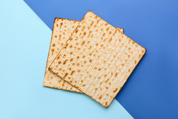 Jewish flatbread matza for Passover on blue background