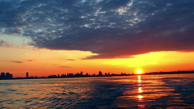 Burning sunrise reflection in New York Harbor