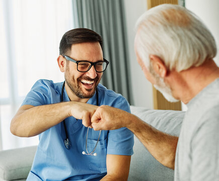 nurse doctor senior care caregiver help assistence fistgreeting gesture hand retirement home nursing elderly health support teamwork man