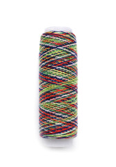 Rainbow sewing thread spool on white background