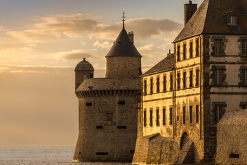 Beautiful shot of a castle in Mont Saint-Michel in the sunset.