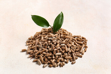 Pile of wood pellets on light background