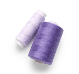 Different thread spools on white background