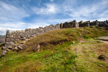 Beautiful view of the Saqsaywaman Inca archaeological site with large stone walls in Cusco, Peru