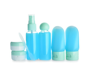 Set of travel bottles and jars with cosmetic products on white background