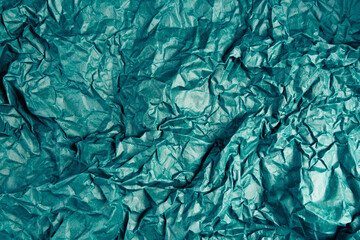 Crumpled old recycled blank empty green blue paper background. Eco-friendly design, eco-friendly concept for your banner on the topic of economical consumption.