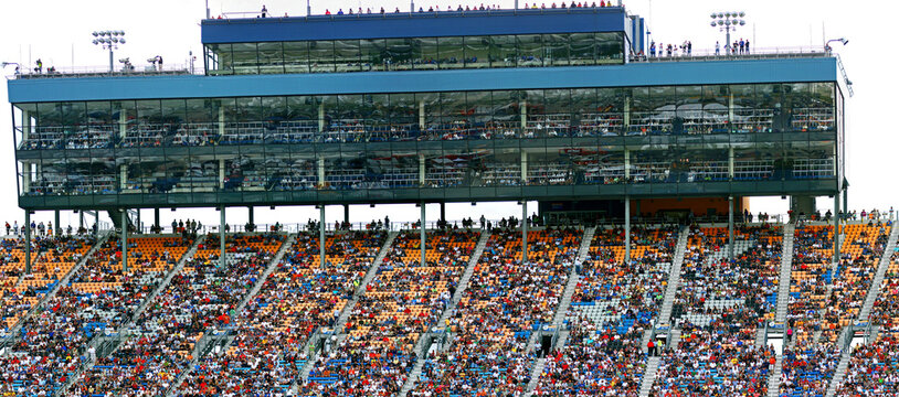 Sports fans in the grandstands at a large sporting event.arena