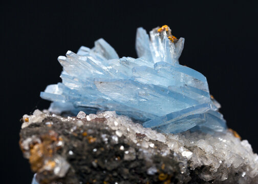 Close-up shot of barite stone mineral specimen isolated on a black background