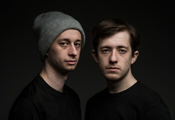 portrait of two Ukrainian twin brothers with confident emotions