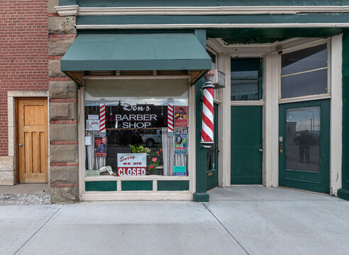 Fort Macleod, Alberta, Canada – March 17, 2022:  Exterior view of “Don’s Barber Shop” in the town’s historic downtown