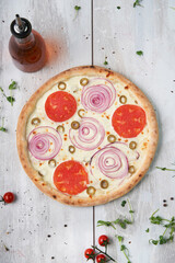 Simple pizza with onions and tomatoes