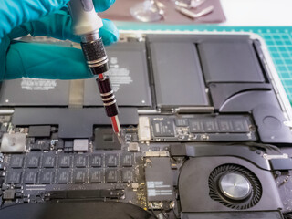 Close-up of Hand with precision screwdriver.