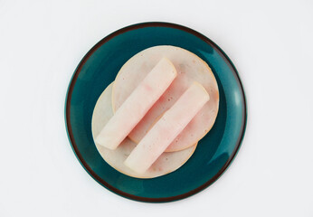 Thinly sliced pieces of meat sausage ham