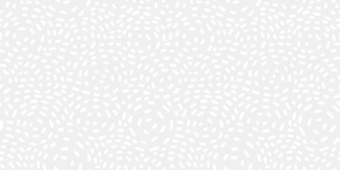 Fototapeta premium Neutral seamless pattern with white strokes on light grey background. Low-contrast non-directional repeat vector design with circle shapes. 