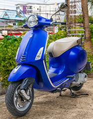 Blue Motor bike at temple in Phuket town thailand. 