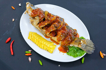 Deep fried Sea bass with sweet and sour sauce or Fish fried,Spicy Sauce,Popular food of Asian people