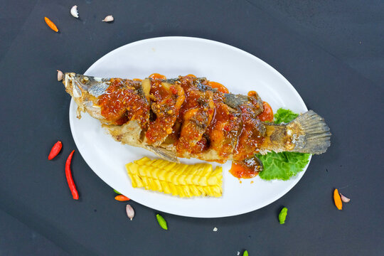 Deep fried Sea bass with sweet and sour sauce or Fish fried,Spicy Sauce,Popular food of Asian people