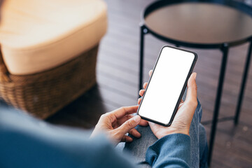 cell phone blank white screen mockup.hand holding texting using mobile on desk at office.background empty space for advertise.work people contact marketing business,technology