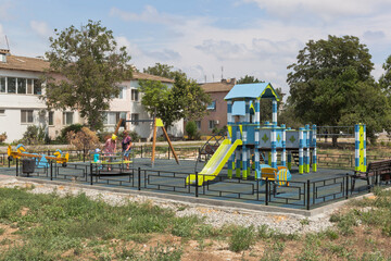Fototapeta na wymiar New playground on Kirov street in the village of Uyutnoye, Saki district, Evpatoria, Crimea
