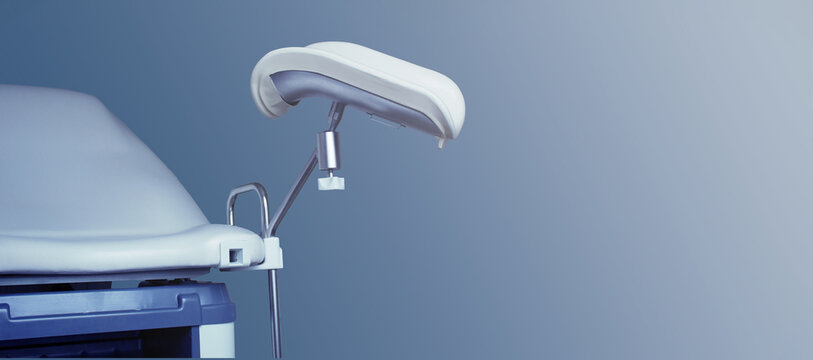 Gynecological chair on a blue background. Women's health concept