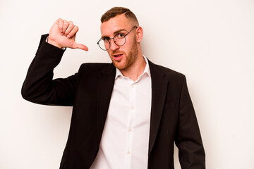 Young business caucasian man isolated on white background showing a dislike gesture, thumbs down....