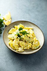 Traditional homemade potato salad with fresh parsley