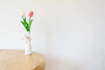 Tulips flower in a vase on a white background