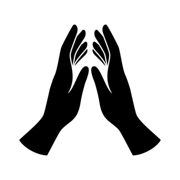 Praying hands black silhouette icon vector. Human hands in prayer icon vector isolated on a white background