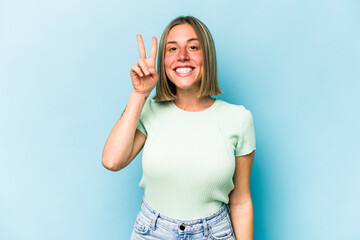 Fototapeta premium Young caucasian woman isolated on blue background showing number two with fingers.