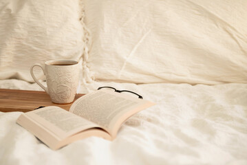 Tea with a book in bed