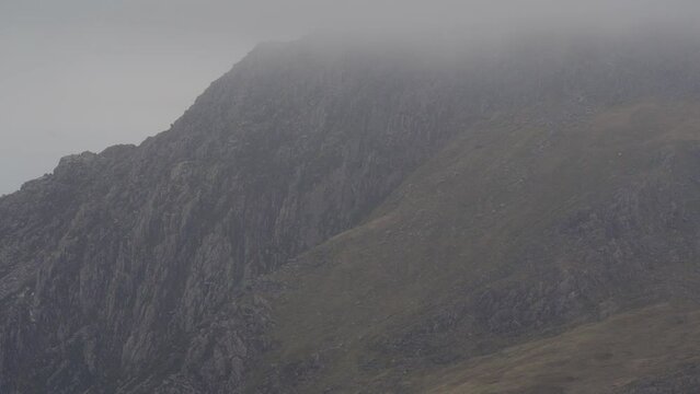 Static background shot of a misty mountain landscape