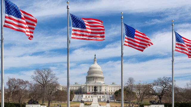 The United States Capitol Building and American flags in Washington DC, USA.	