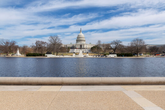 United States Capitol building at sunny day in Washington DC.