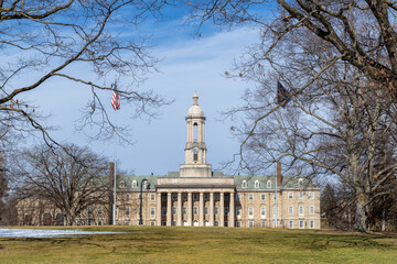 The Old Main building on the campus of Penn State University in spring sunny day, State College,...
