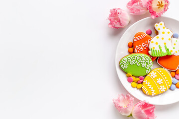 Easter cookies eggs and bunny on plate. Happy Easter background