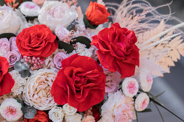 Red rose and peach peonies in a big round box for mother's day, valentine's day, Woman's day 8 march.