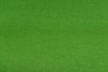 Green linen texture. Green cover. Cloth close-up.
