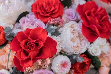 Red rose and peach peonies in a big round box for mother's day, valentine's day, Woman's day 8 march.