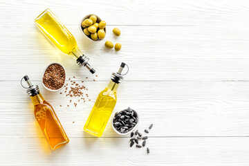 Bottles of cooking oil - sunflower olive and sesame oil with seeds