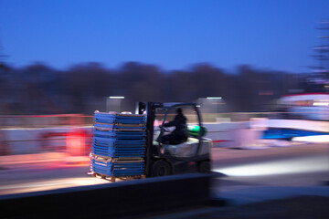 Forklift in motion in the port. Photo in blur.