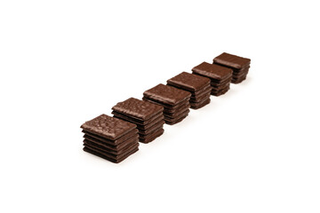 Dark chocolate candies isolated on white background.