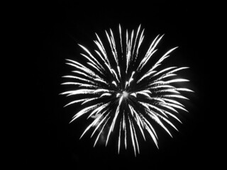 Closeup of the fireworks against the night sky, shot in grayscale