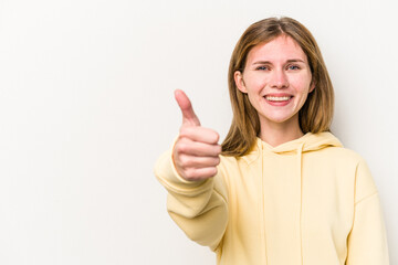 Young russian woman isolated on white background smiling and raising thumb up