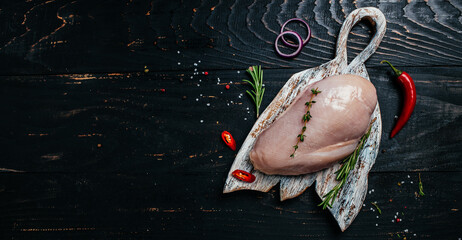 Raw turkey fillet on cutting board, Cooking ingredients. Natural healthy food concept. Long banner format. top view