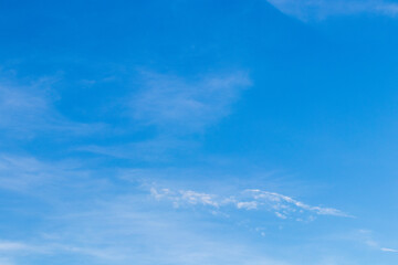 Naklejka na ściany i meble Blue sky with white thin clouds.